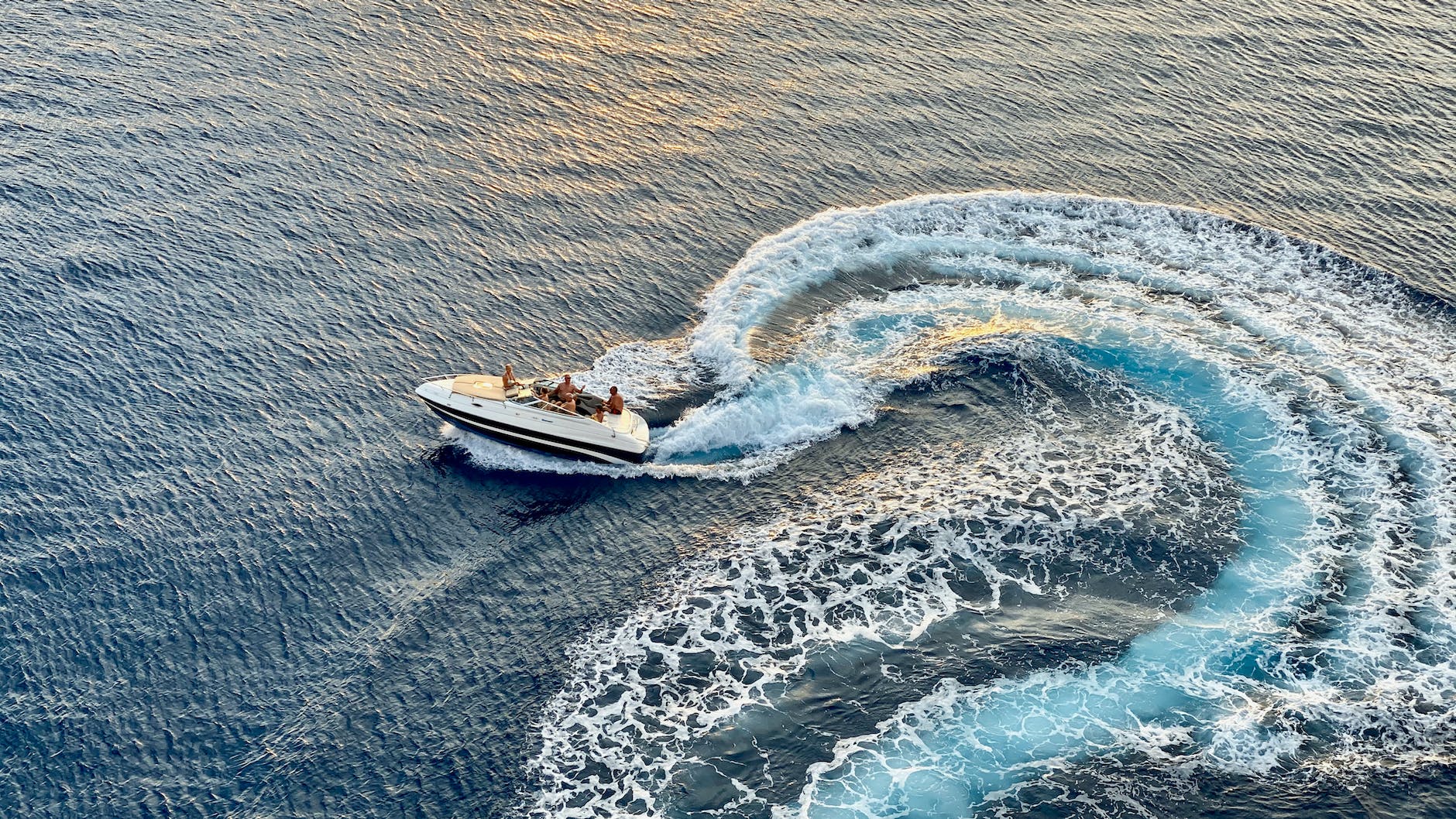 photo of speed boat on sea