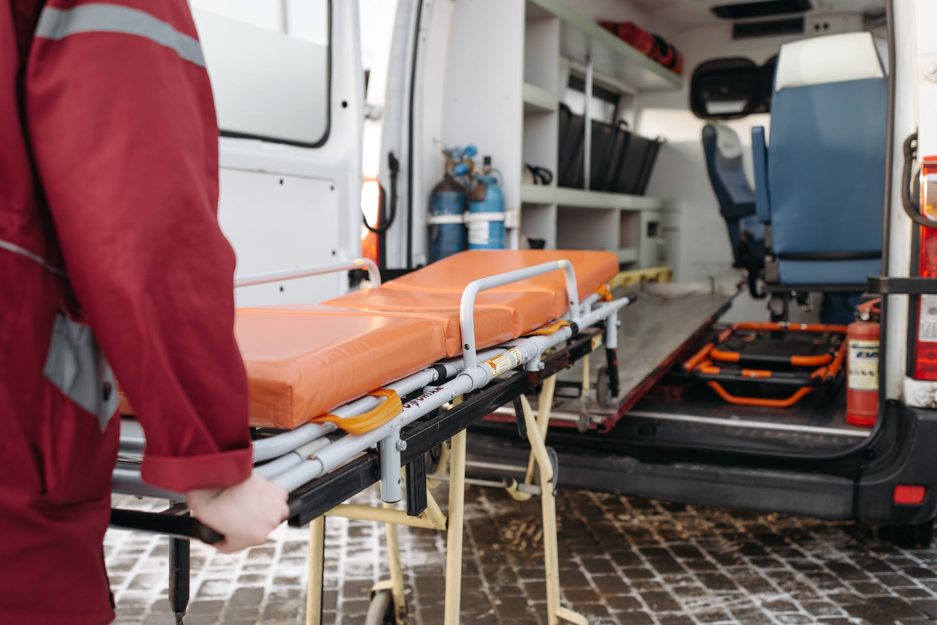 man pushing a stretcher