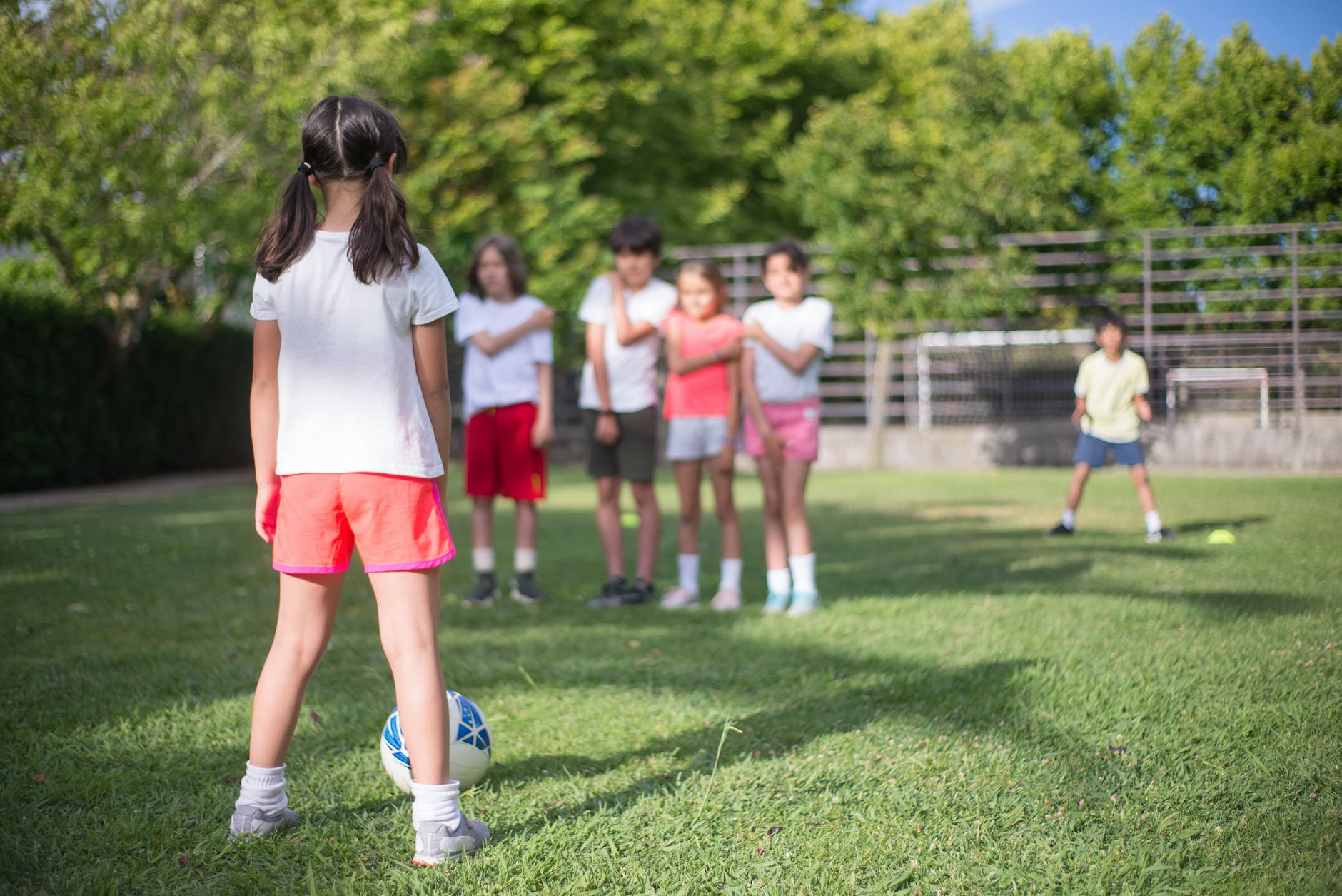 a child playing football at a park