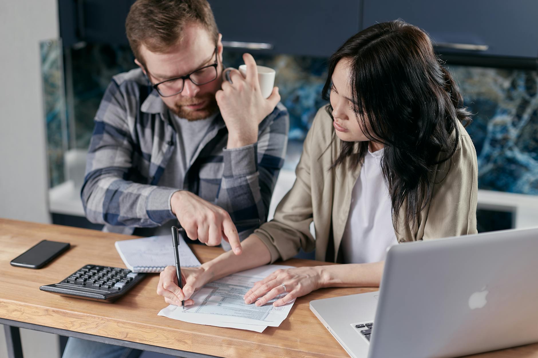 couple calculating all their bills