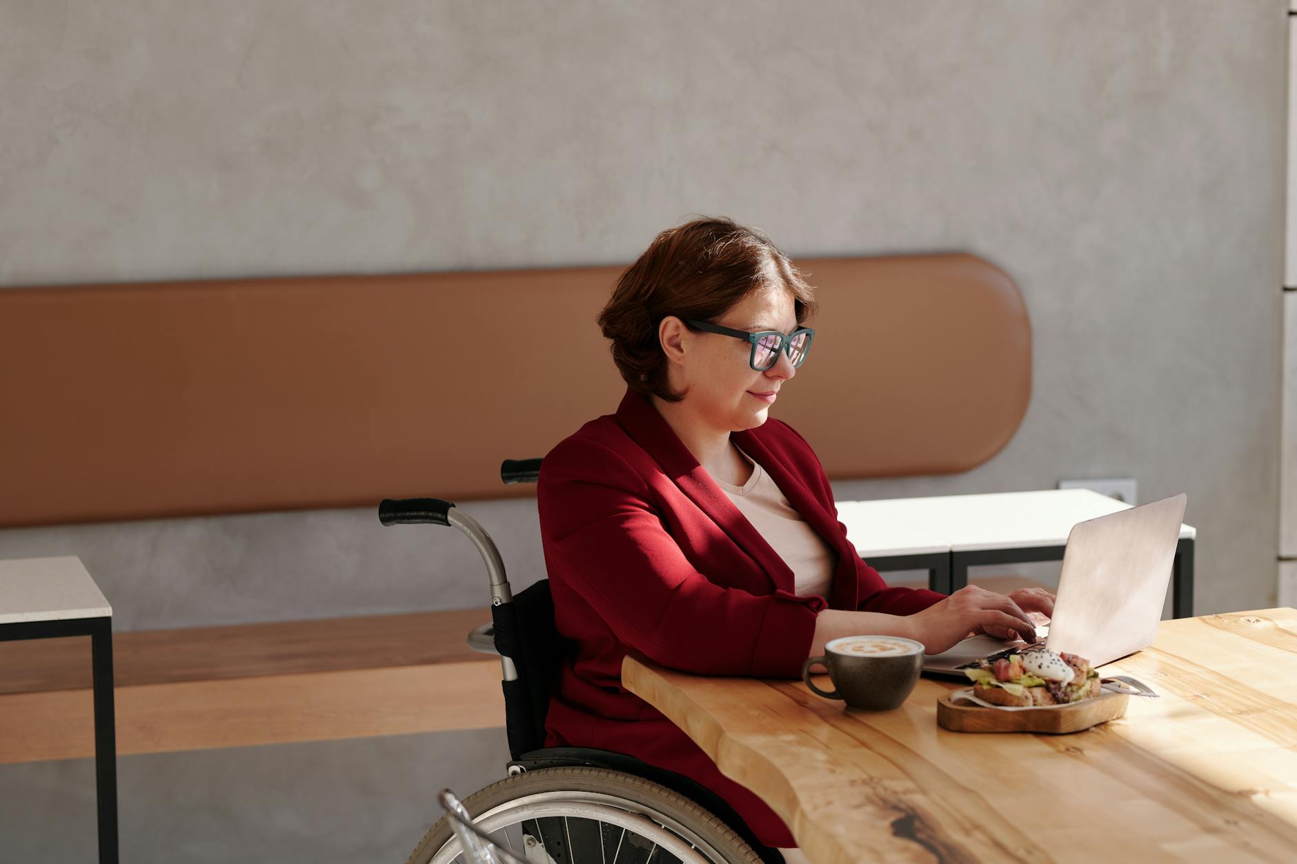 photo of woman using laptop