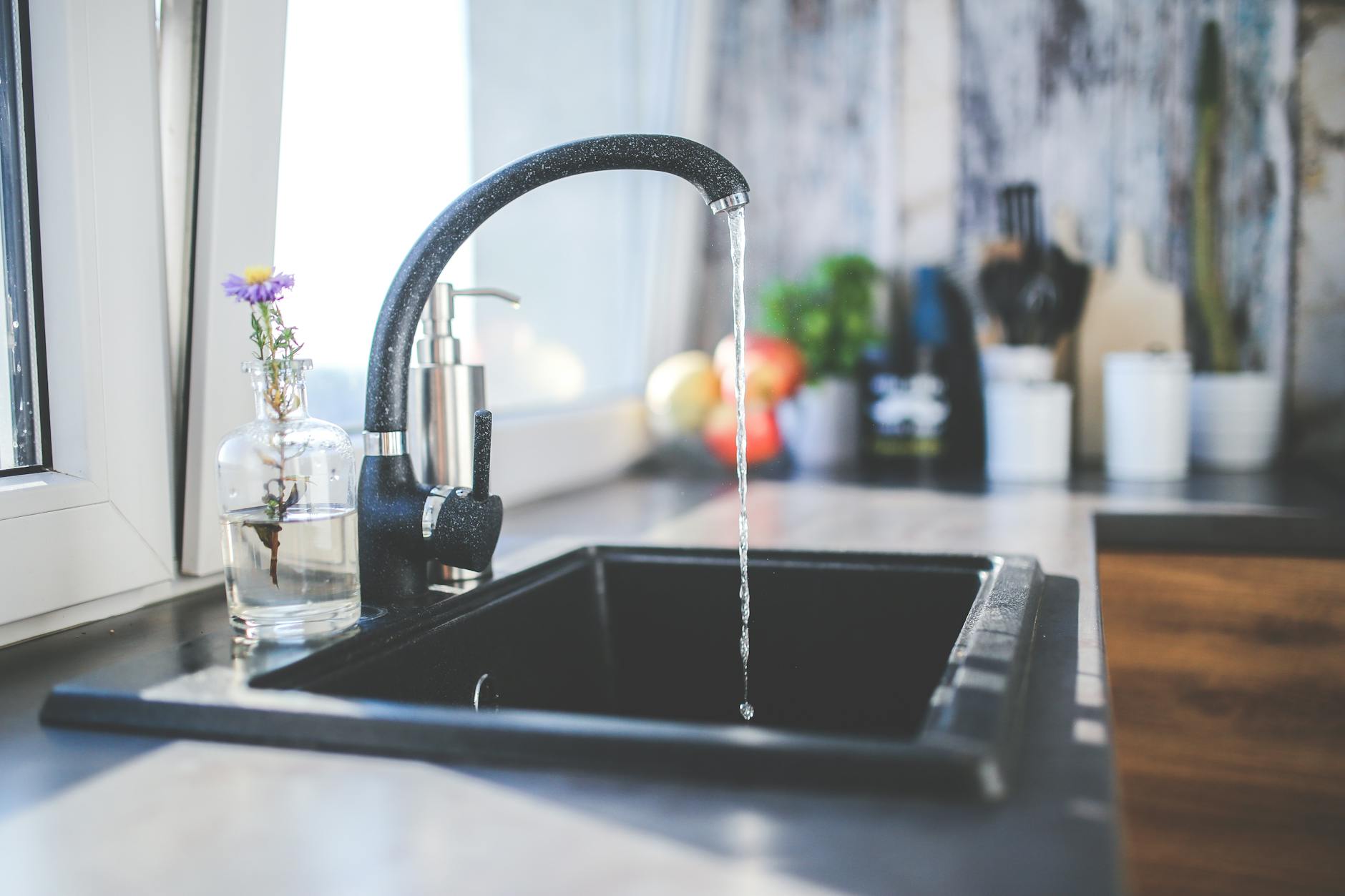 water flows from the tap to sink