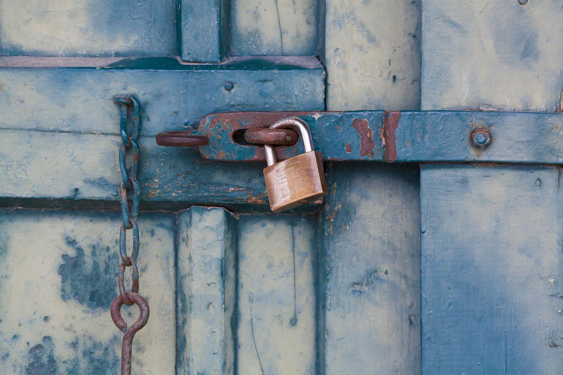 gold padlock locking door